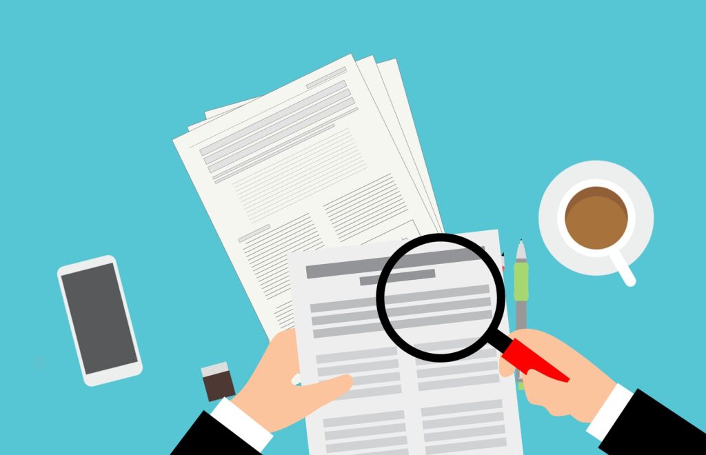 cartoon of a magnifying glass looking at a document to be shredded by DataSafe in Portland OR
