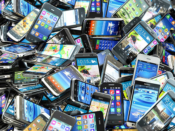 Mobile phones background. Pile of different modern smartphones. 3d