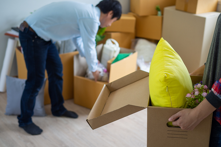 Woman is carrying the box for personal items
