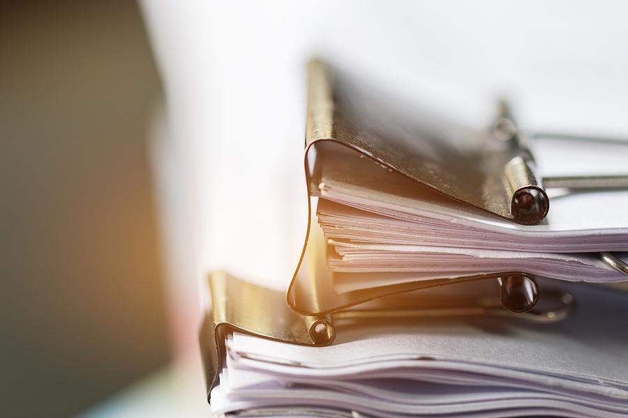 Stack of Paper documents with clips,